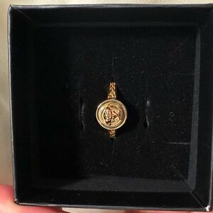 Versace sunglasses, and rings